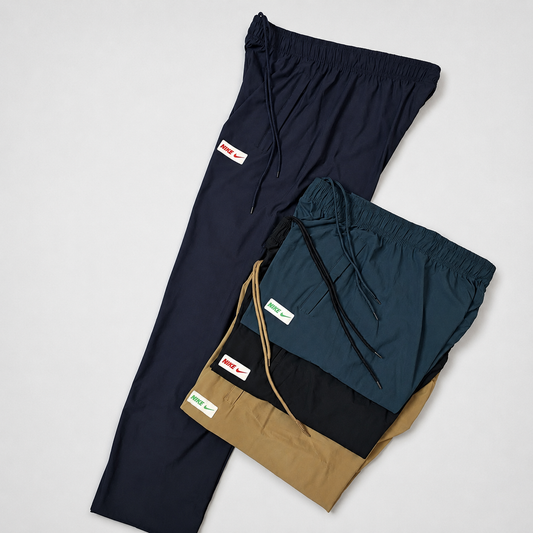 Assorted Nike Lycra open bottom trousers in blue, teal, black, and tan with drawstring waists and back pockets